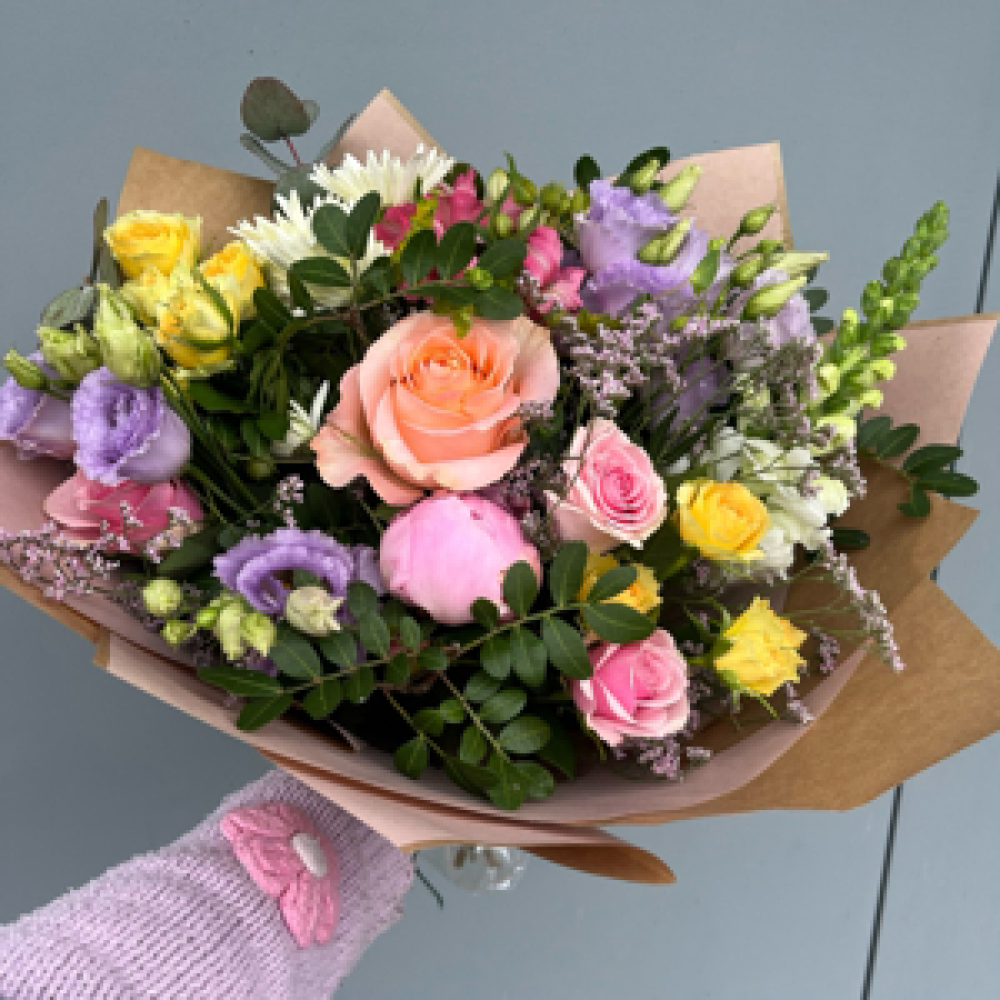 Florist choice of seasonal pastels tones